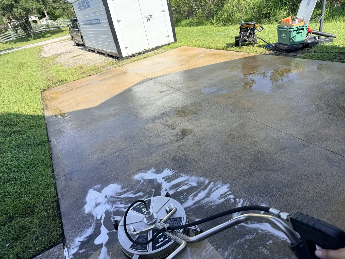 Surface cleaner washing a concrete pad